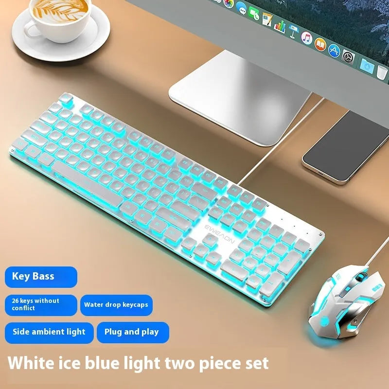 Wired computer keyboard with mute button and blue backlighting on a desk