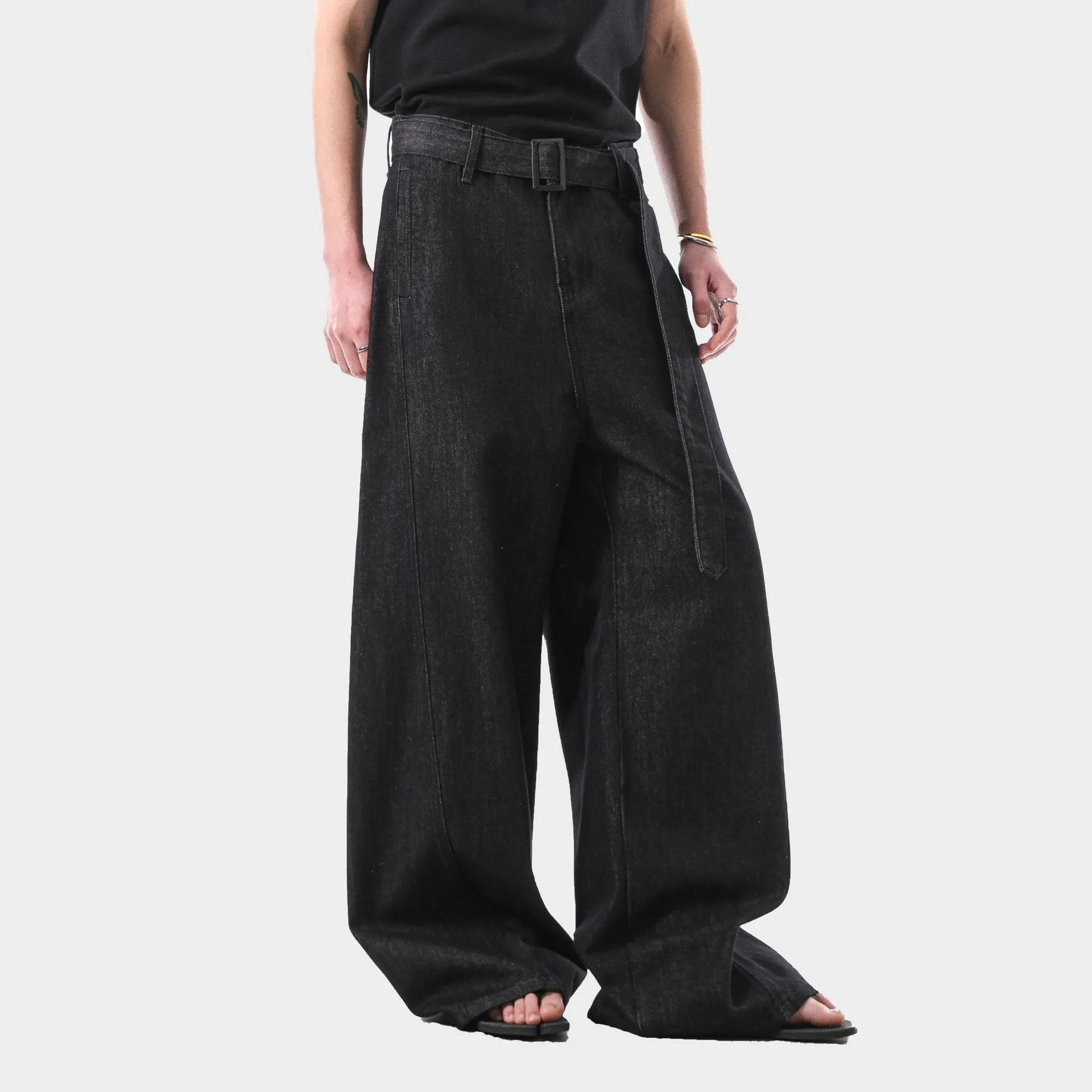 Black high waist straight leg denim jeans on a neutral background.