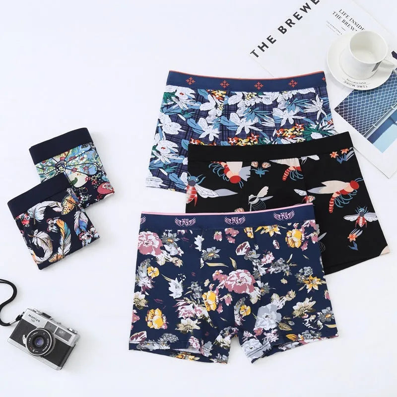 Men's cotton boxer briefs on a white background, showing the U-shaped pouch design and a floral pattern.