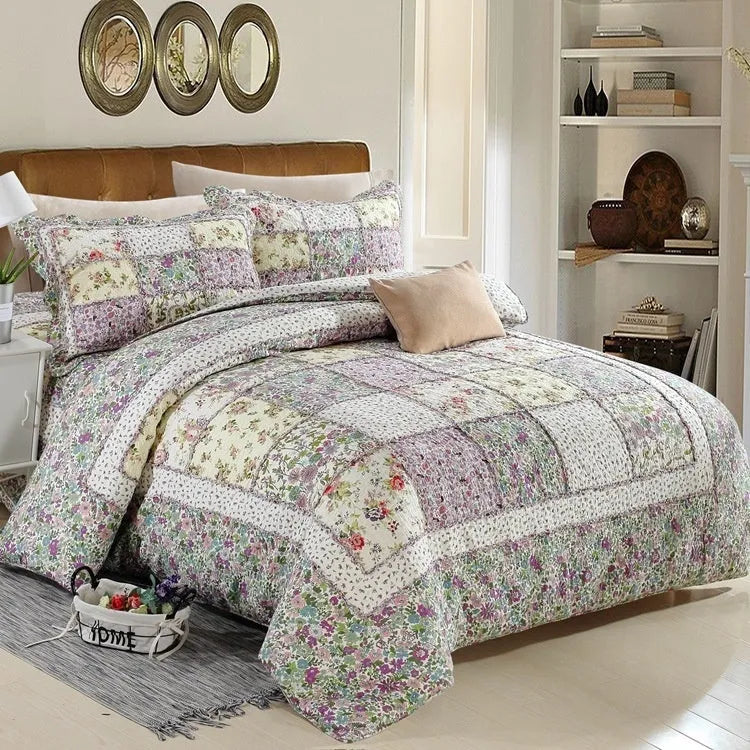 Pure cotton quilted bedspread three-piece set in washed fabric with pillowcases on a bed.