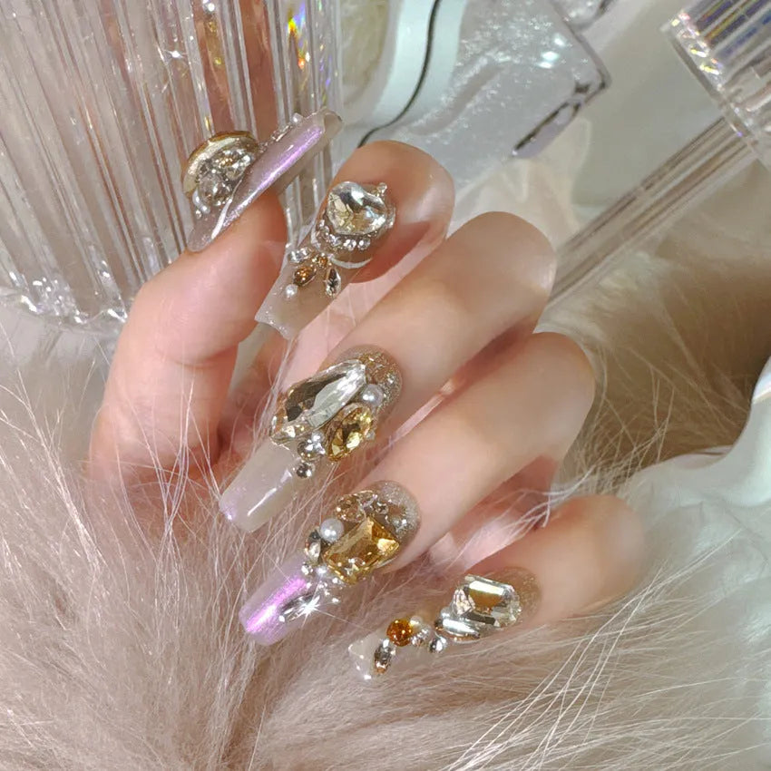 Rhinestone-decorated false nail patches on card packaging with application adhesive and tools