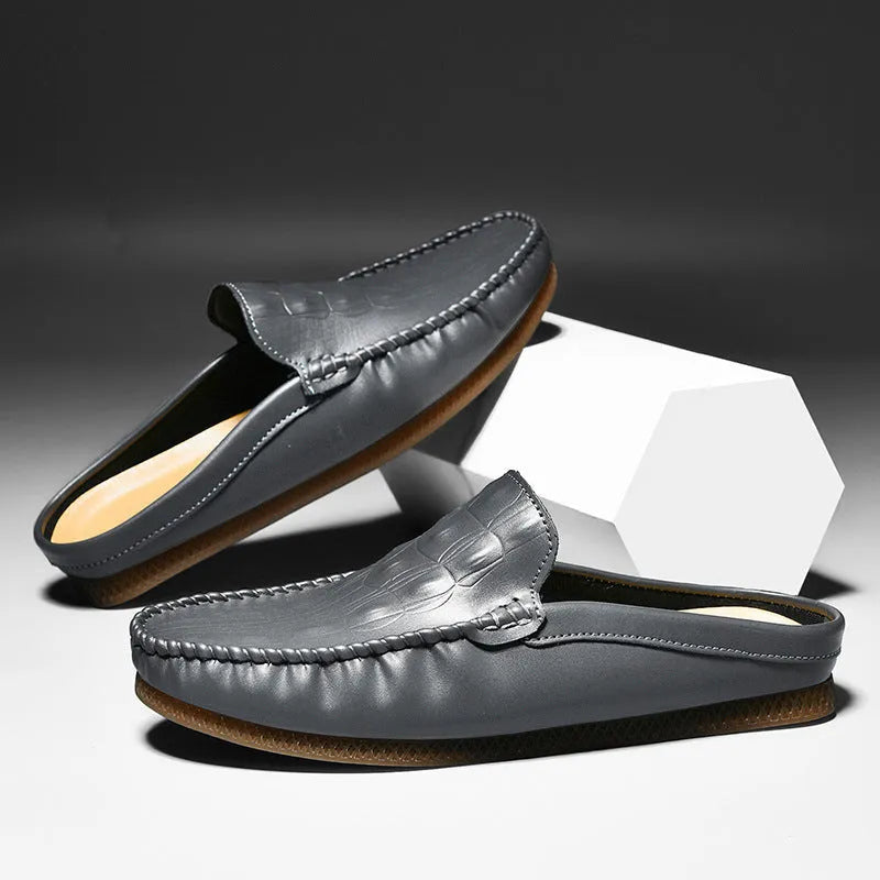 Men's black leisure semi-slipper with Gommino rubber sole and breathable artificial PU upper.