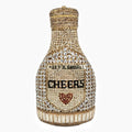 Gold champagne bottle shaped evening clutch with alloy frame measuring 20cm tall