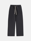 Men's black fleece-lined sweatpants with a drawstring elastic waistband and loose fit leg.