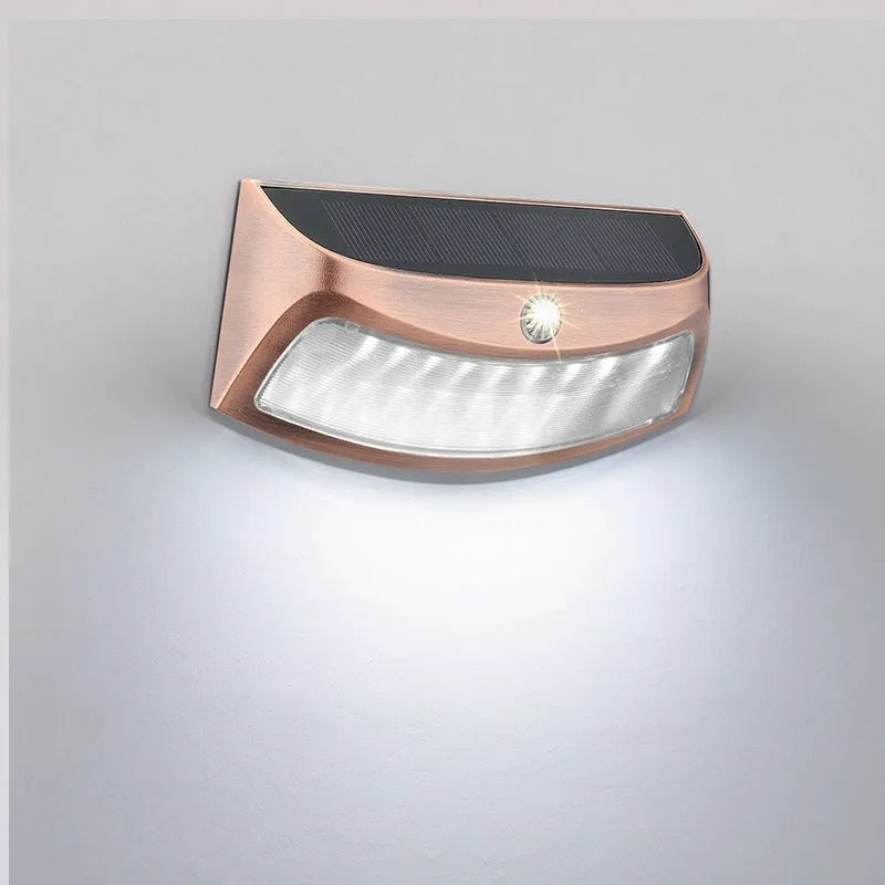 Solar powered outdoor wall light with retro smiling face design for garden courtyard decoration
