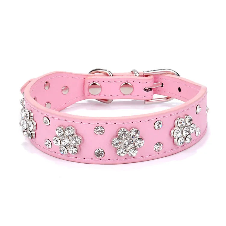 Black PU leather dog collar with rhinestone flowers and metal studs, showing the adjustable eyelets and D-ring.