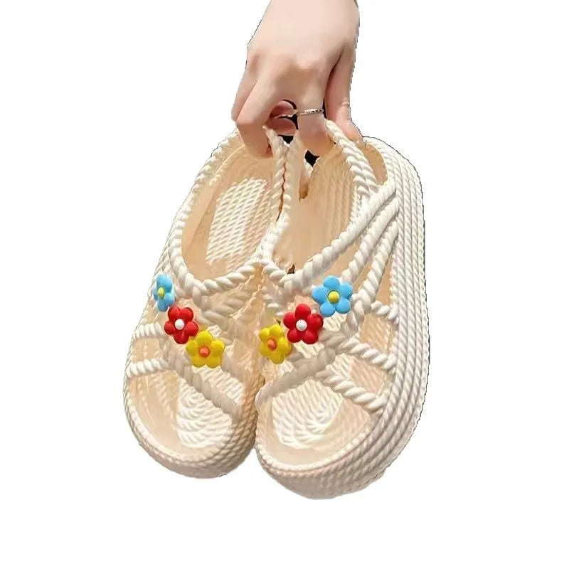 Beige women's round-toe sandals with sunflower pattern and non-slip PVC sole.