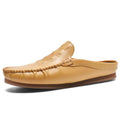 Men's black leisure semi-slipper with Gommino rubber sole and breathable artificial PU upper.