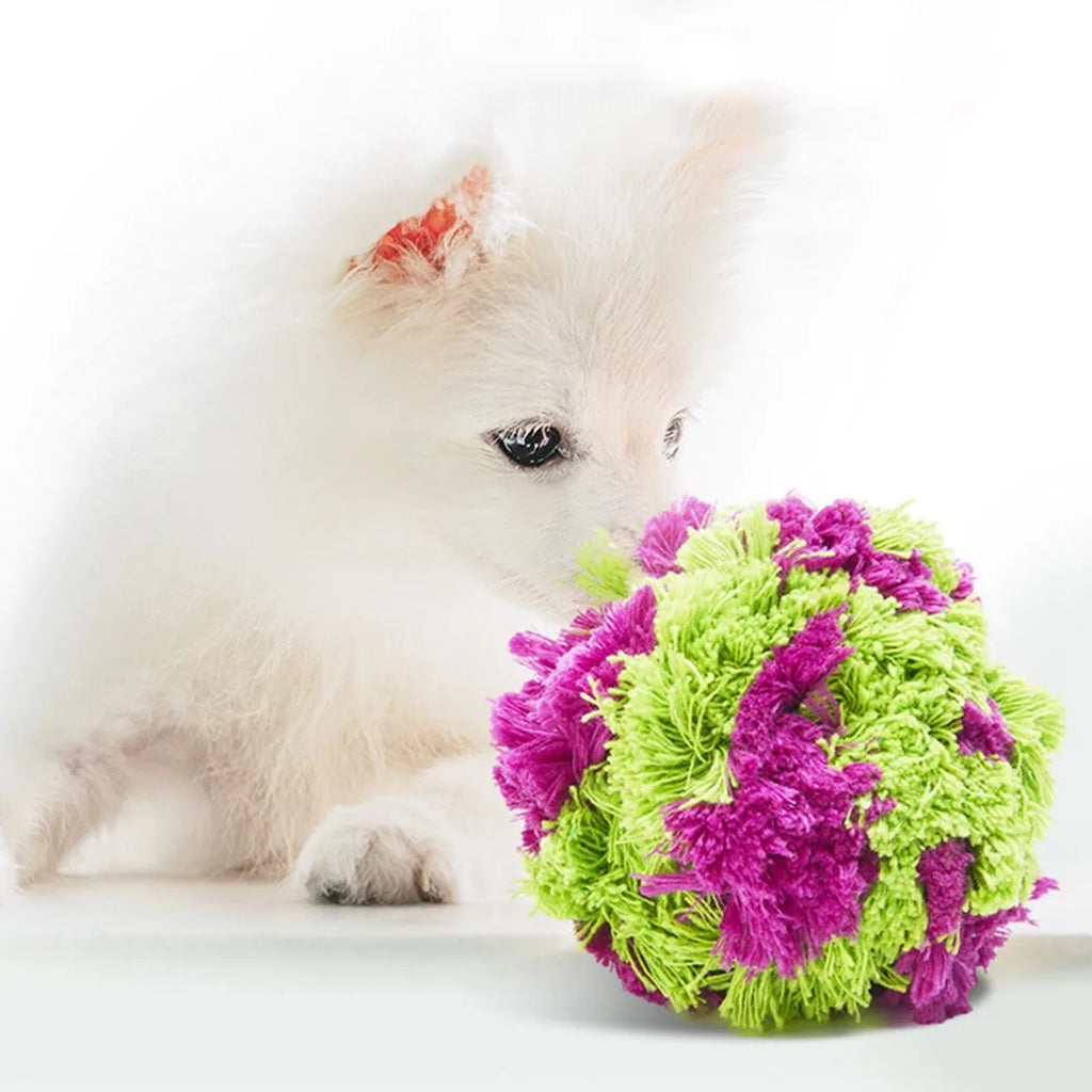 Purple plush dog chew ball with knotted seaweed design measuring 15cm diameter