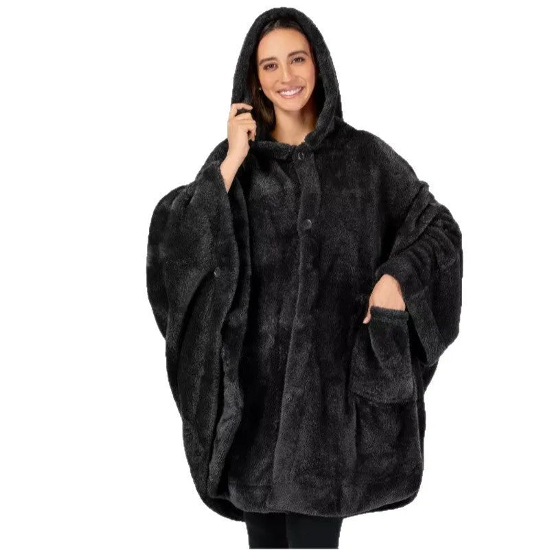 Thick hooded long sleeve bathrobe in black hanging on a hook