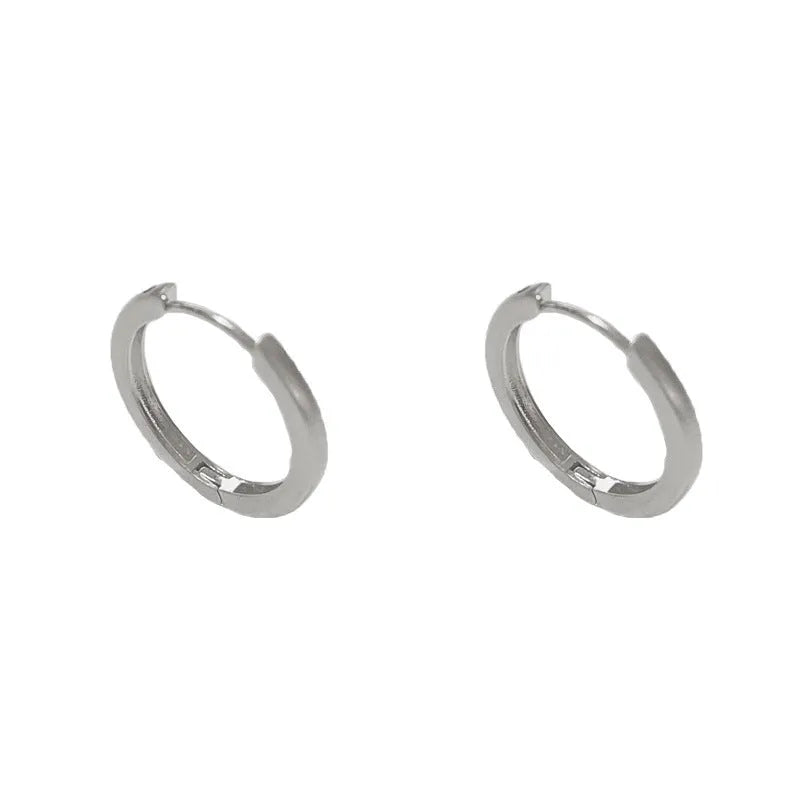 Geometric round ear clip jewellery with gold plating in minimalist style