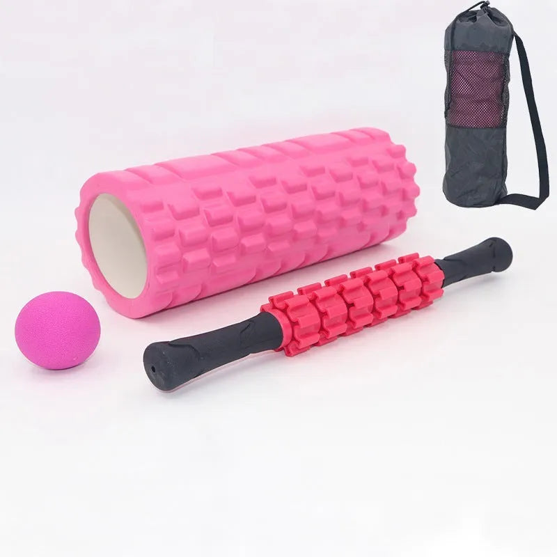 Black foam massage roller stick with six textured sections measuring 33cm long
