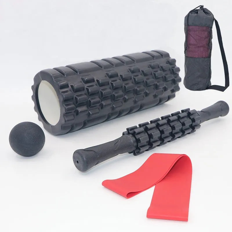 Black foam massage roller stick with six textured sections measuring 33cm long