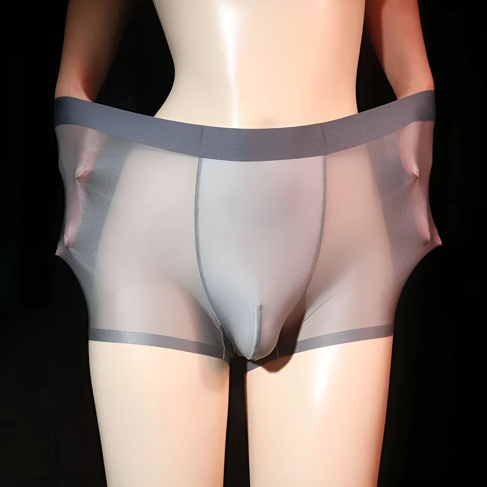Men's solid colour ultra-thin transparent nylon ice silk boxer shorts on a size chart.
