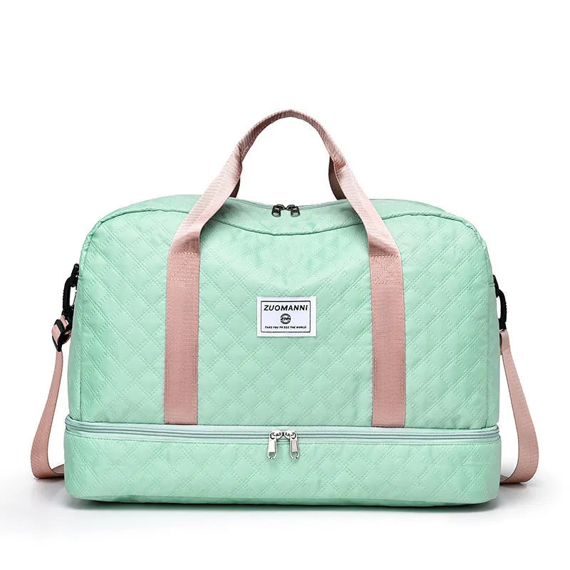 Large Oxford cloth travel bag with 36-55 litre capacity shown in haze blue colour