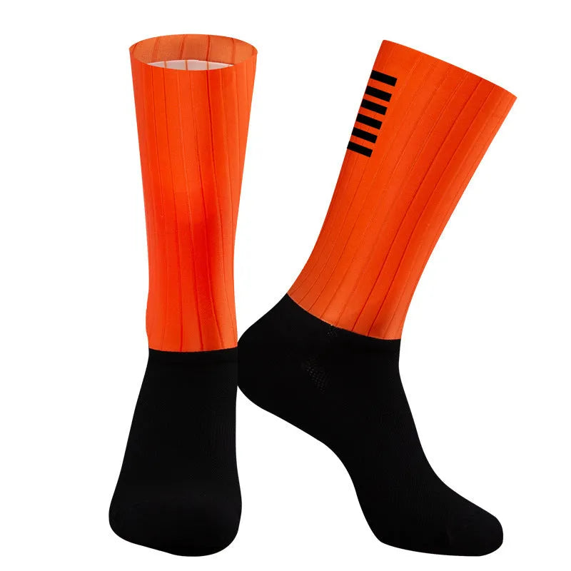A pair of breathable athletic cycling socks in a chemical fibre blend, shown in one of six available colours.
