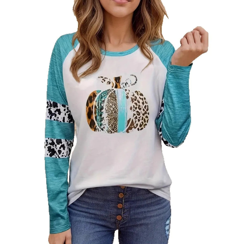 Sky blue Halloween t-shirt featuring a large white 3D digitally printed pumpkin design on the front.