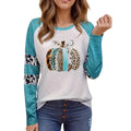 Sky blue Halloween t-shirt featuring a large white 3D digitally printed pumpkin design on the front.