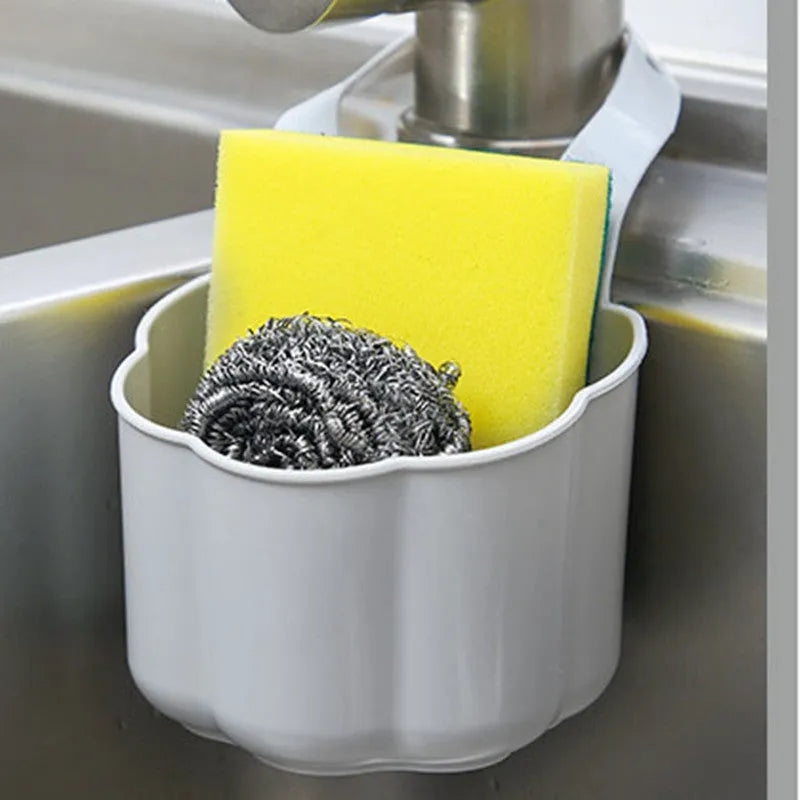 Dark blue Nordic style plastic drain basket next to a kitchen sink
