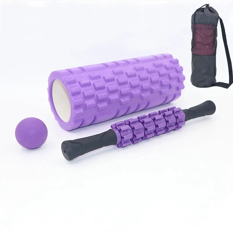 Black foam massage roller stick with six textured sections measuring 33cm long