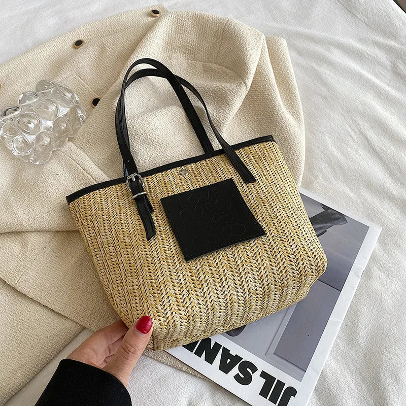 Straw woven women's shoulder bag with three-dimensional pockets in black colour option