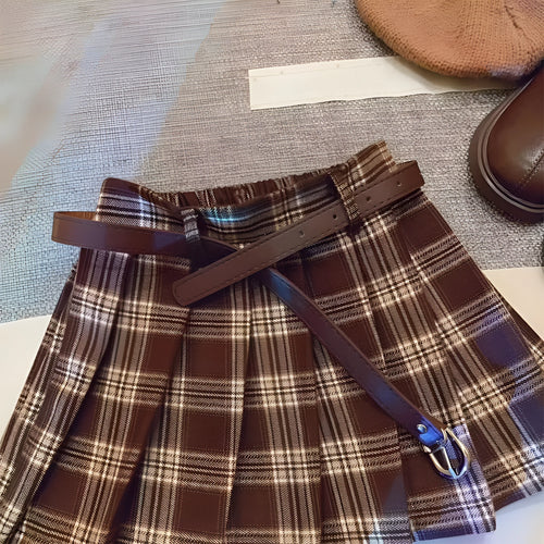 Girls' plaid pleated A-line skirt with an elastic waistband on a hanger.