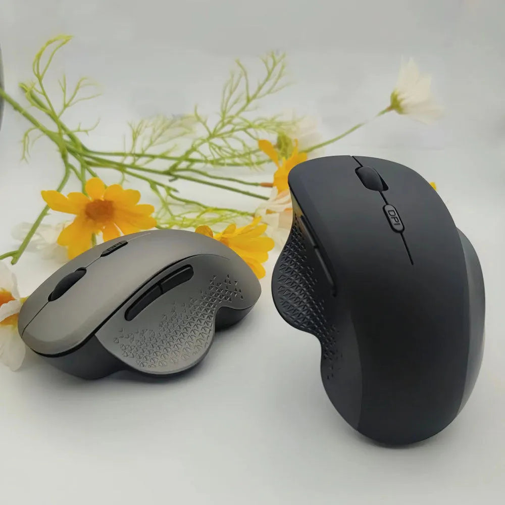 Black or grey wireless rechargeable mouse for laptops with USB cable, showing compact design.