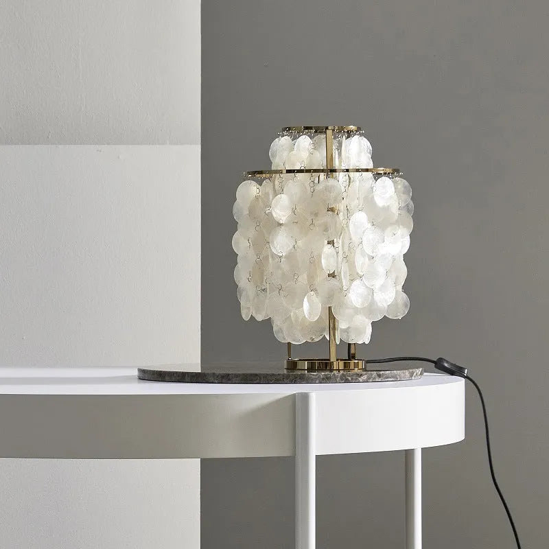 Modern shell bedside table lamp in chrome finish with 30cm diameter shade