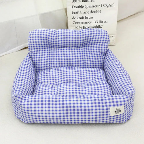 Car-mounted pet travel nest in stain-resistant cloth with grey or blue plaid options