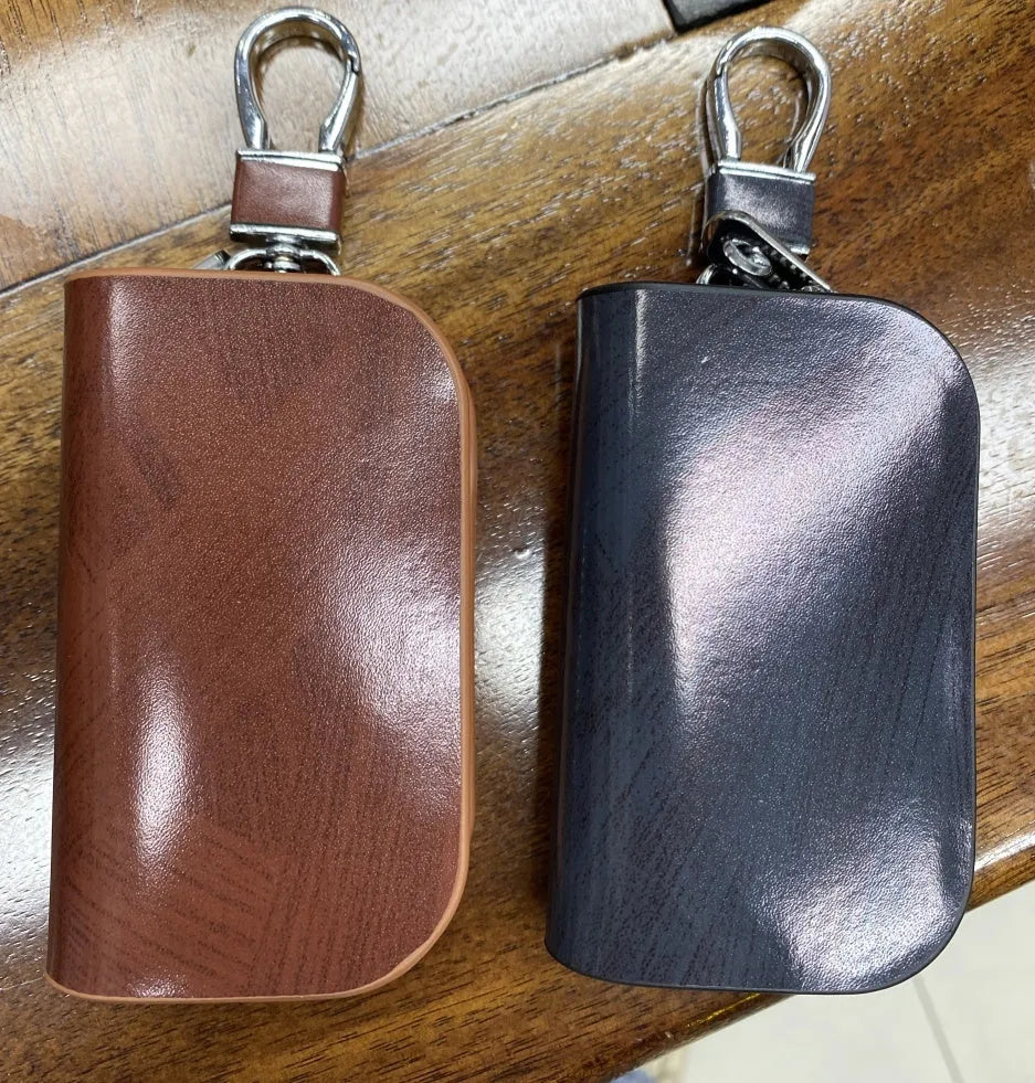 Genuine leather car key case with frosted finish in black or brown colour.