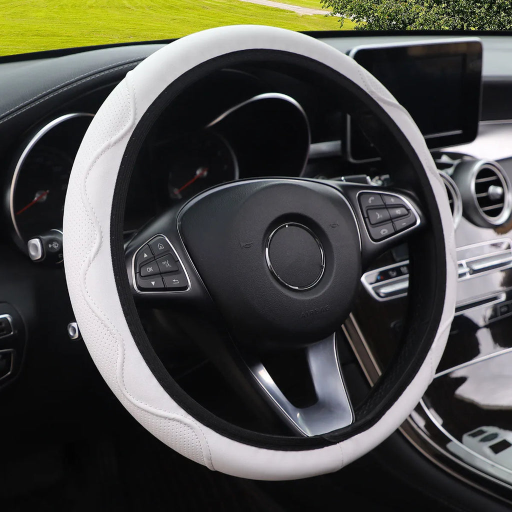 Elastic embossed corrugated PU leather steering wheel cover for 37-38cm diameter wheels in multiple colours.