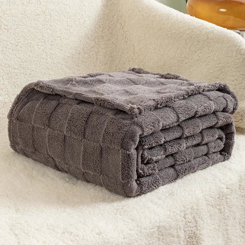 Geometric patterned polyester blanket in milky white showing cotton velvet texture and thickened construction