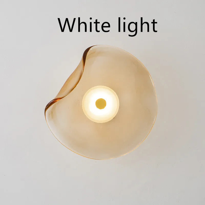 Round glass wall lamp in cognac colour with diffused lighting for bedroom bedside decoration