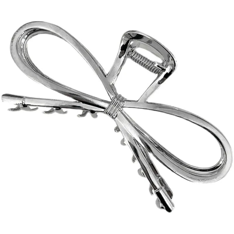 Korean style bow barrette with alloy metal construction in silver colour