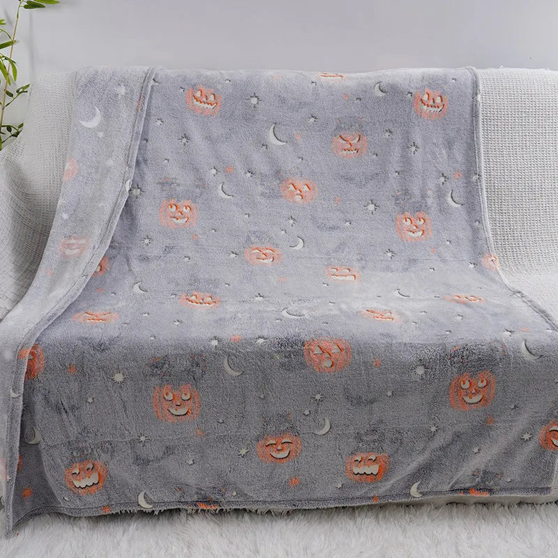 Cartoon print flannel blanket for children shown in two sizes.