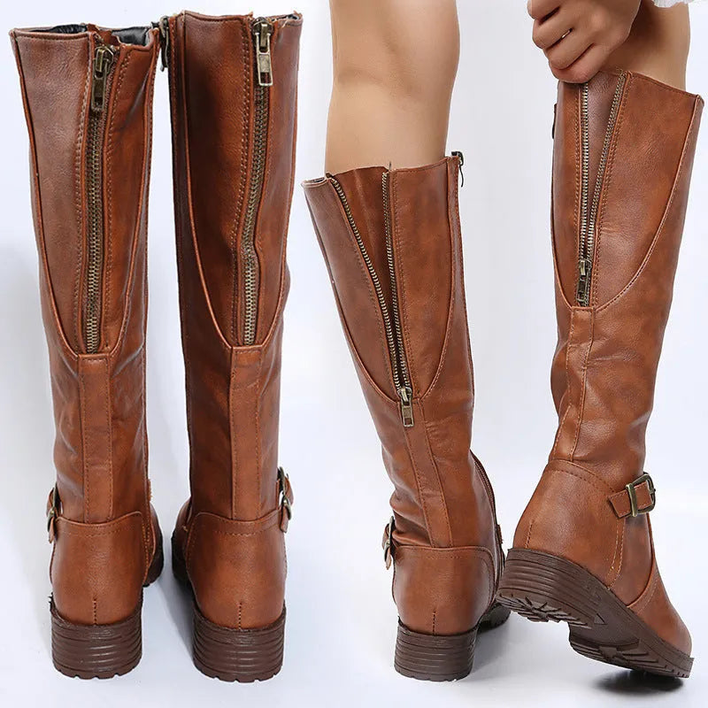 Women's black knight high boots with a square heel, round toe, and a belt buckle detail on the upper.