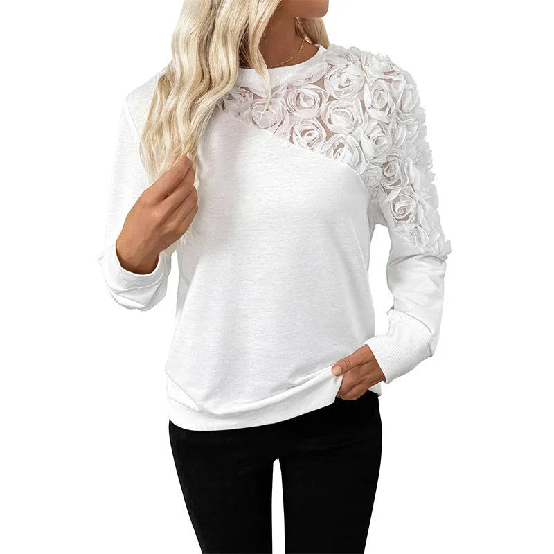 White long sleeve top with flower pattern, loose fit pullover style with regular sleeves