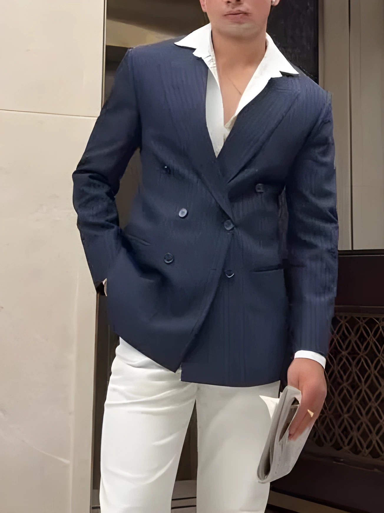 Men's classic stripe double breasted blazer on a hanger, showing regular fit and length.