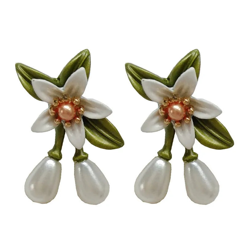 Women's alloy flower earrings with sterling silver needle design and clip-on alternative