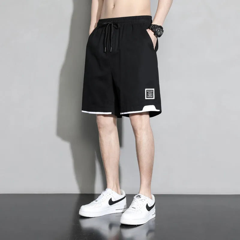 Boys' cotton summer shorts in sporty style available in black, khaki, and white colours