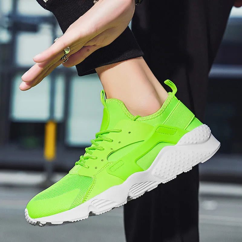 Men's green low top mesh casual shoes with lace-up front and cross shoulder straps on a flat MD sole