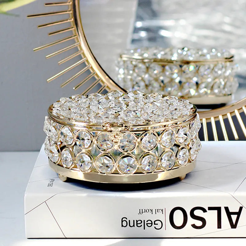 French gold metal jewellery box with a transparent crystal glass lid for storing rings and necklaces.