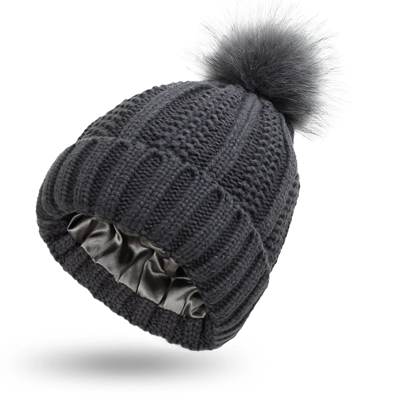 Wool knitted beanie hat with satin lining and faux fur pom pom in beige colour