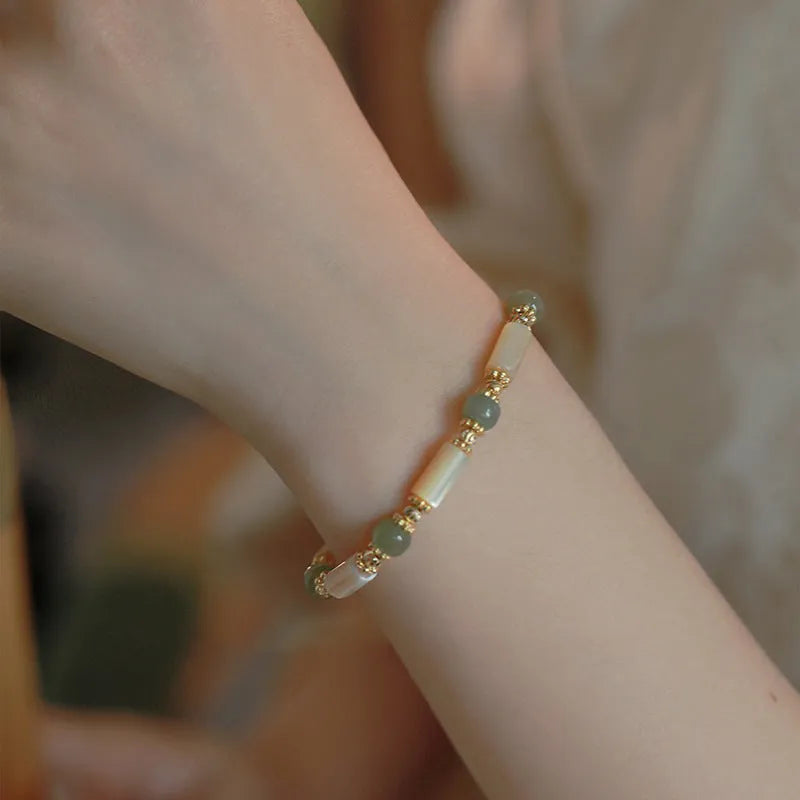 Natural Hetian jade white lip shell bracelet for women with round beads and simple geometric style