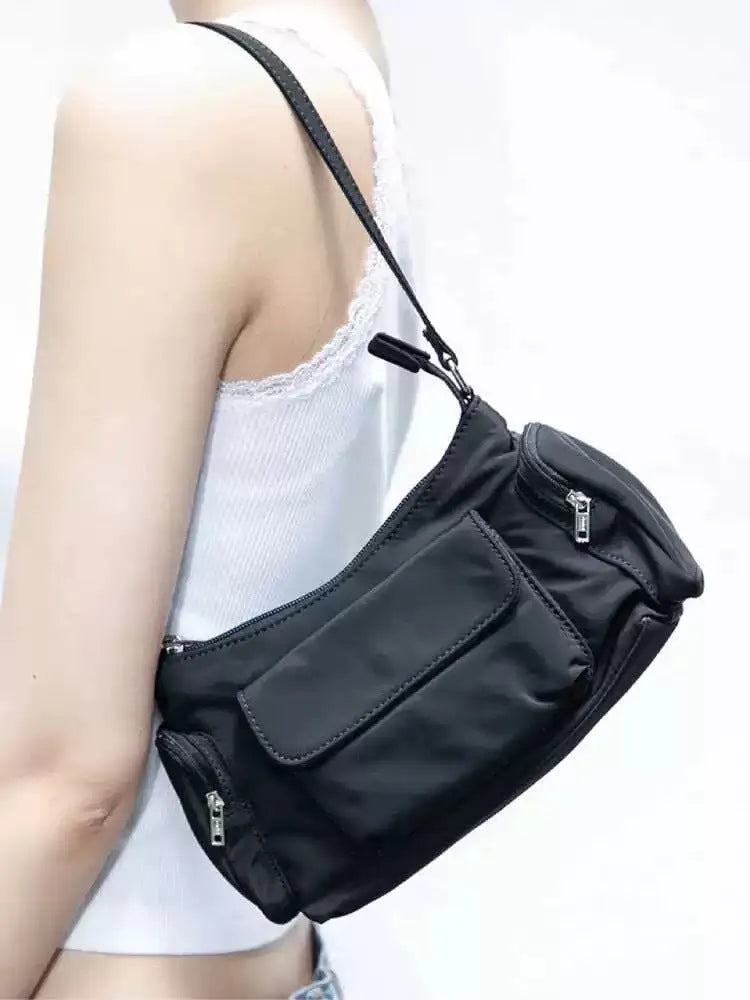 Black PU lightweight shoulder bag with two pockets and side line detail