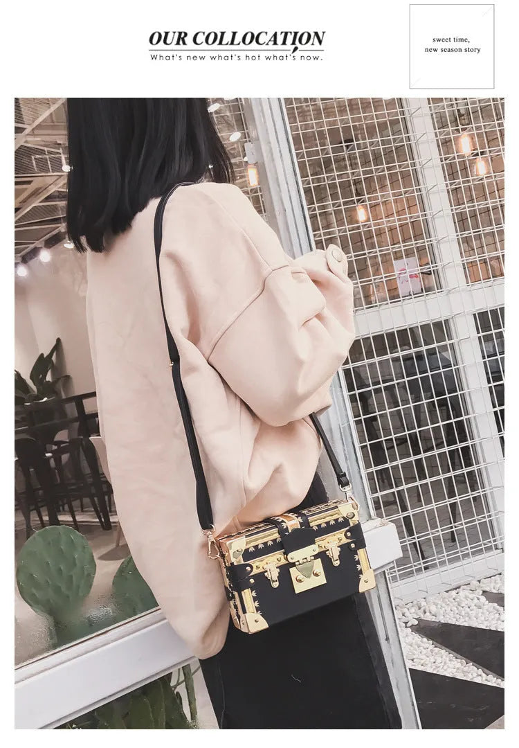 Women's hard black PU leather shoulder bag with flap closure and rivet decoration