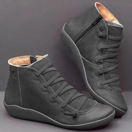 Women's flat casual booties with wedge heel and round toe in multiple colour options.