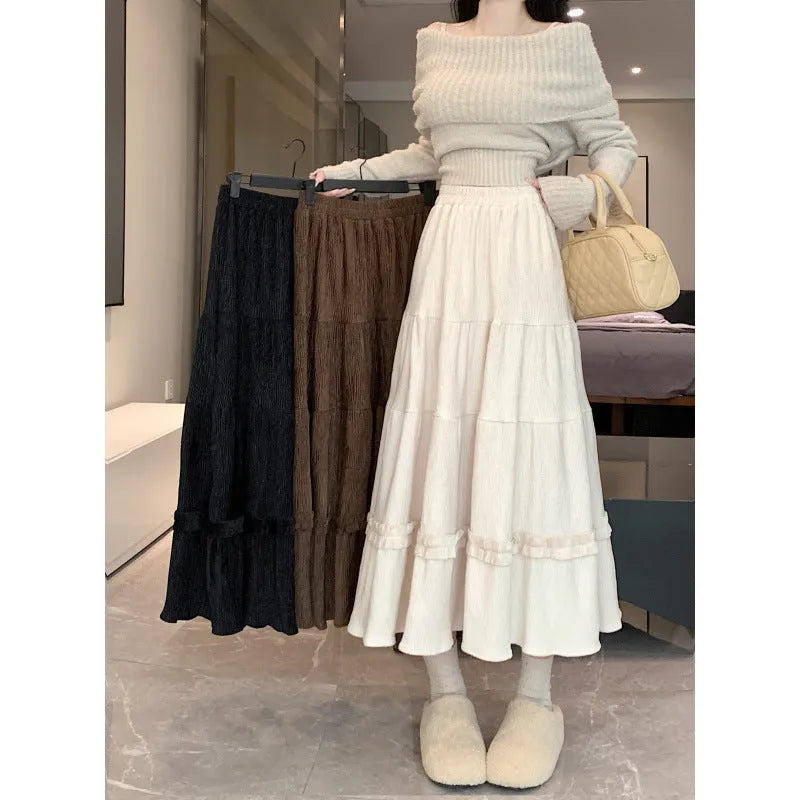 Women's solid colour corduroy A-line midi skirt with an elastic waistband shown in beige.