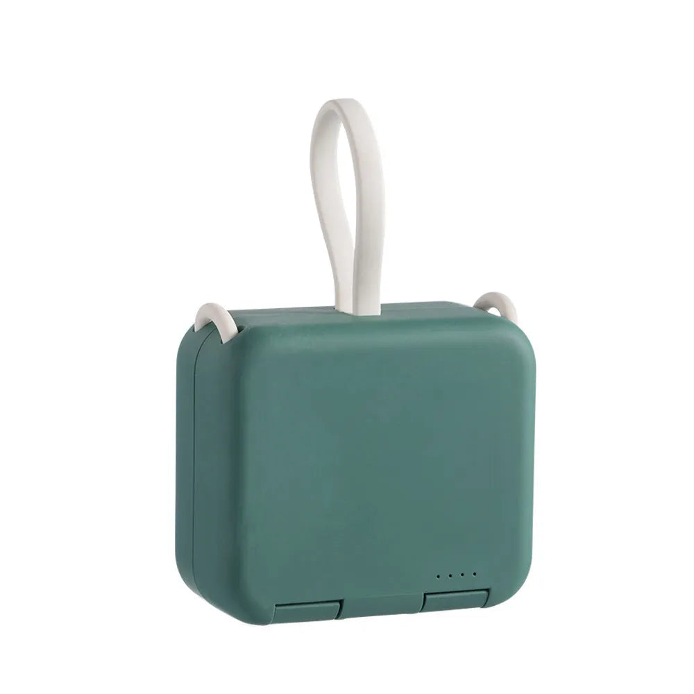 Handbag clip power bank in blue showing phone stand function with charging ports visible