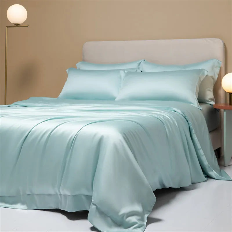 Lenzing Tencel 200 thread count bedding set in satin weave showing Aurora Blue quilt cover and pillowcases